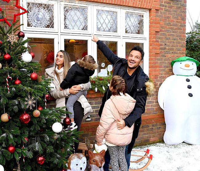 Peter Andre and Emily pose with their two children to show off incredible Christmas décor
