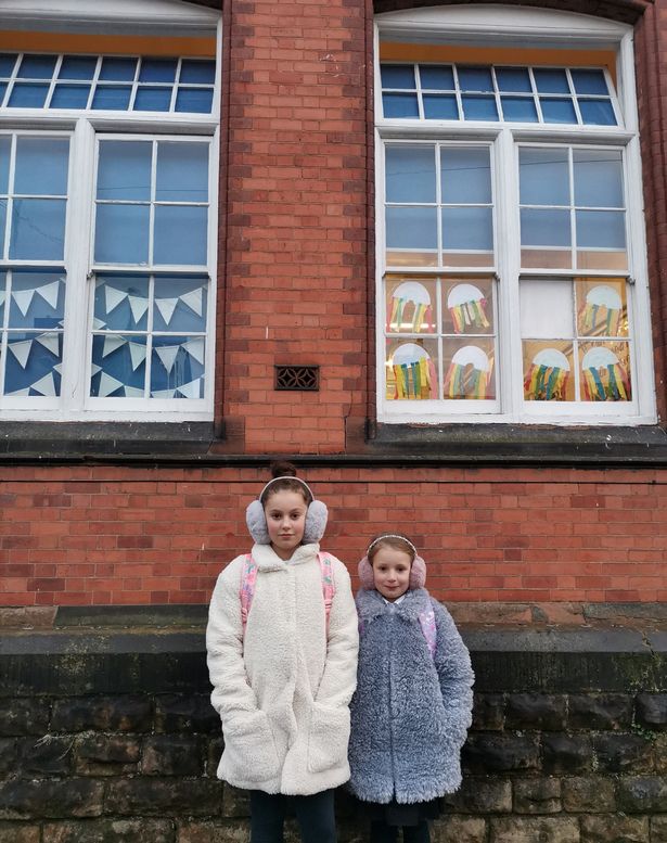 Mum forced to send daughters, 6 and 9, to school in earmuffs as windows kept open