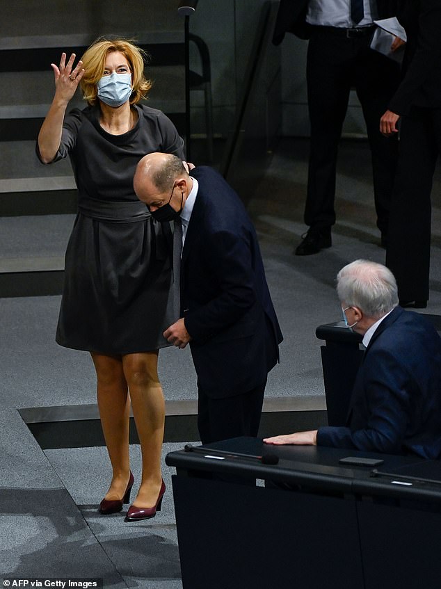 Merkel minister takes a tumble: German agriculture secretary trips on a step, rips her tights and loses her glasses during Bundestag debate
