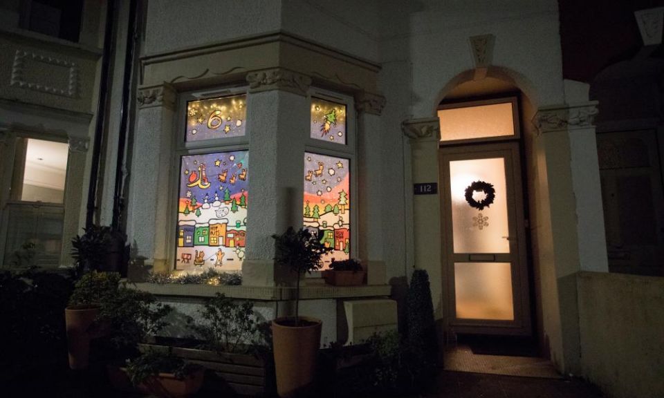 ‘It brings cheer after a rubbish year’: advent windows light up UK streets