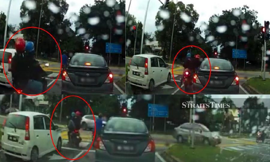 Watch: Man on motorcycle smashes car window, attempts to snatch driver's purse