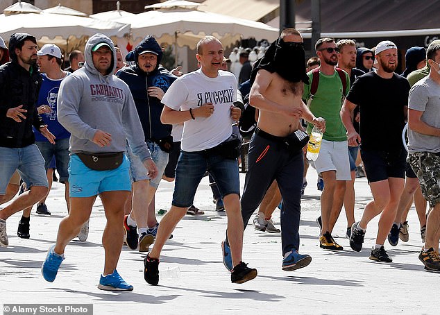 Two Russian hooligans are jailed for ten and three years for beating English fan into a coma and leaving him paralysed amid 'guerilla offensive by Moscow ultras' during Euro 2016