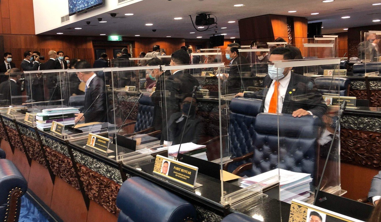 Malaysia opposition stage walkout after ministers exposed to Covid-19 enter parliament wearing PPE