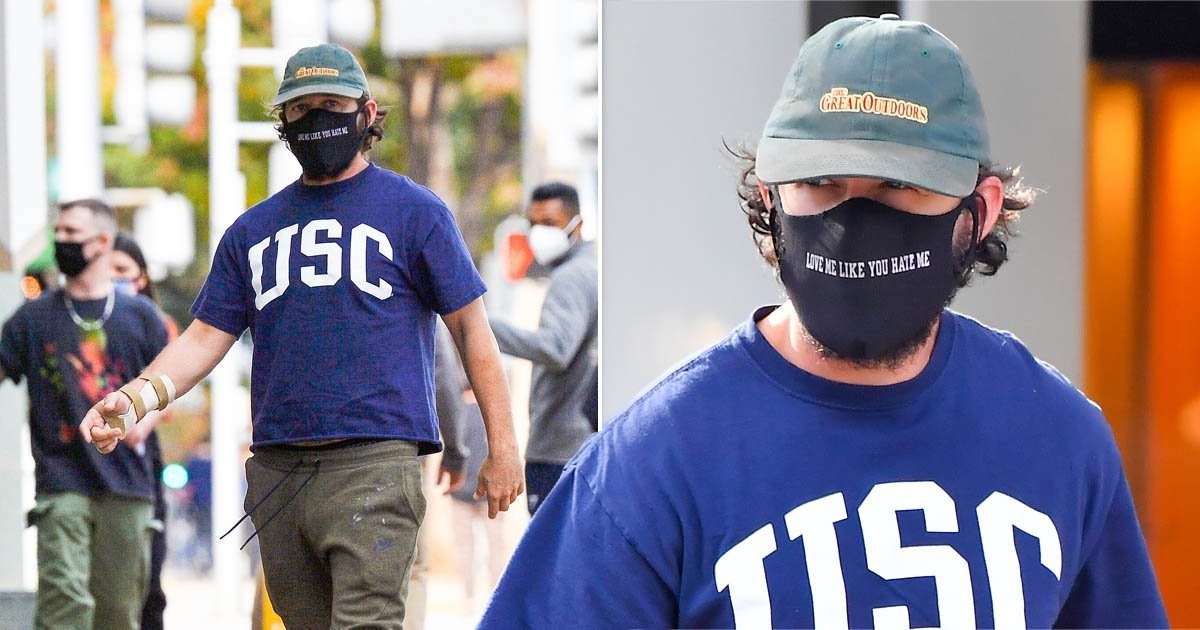 Shia LaBeouf wears mask saying ‘love me like you hate me’ as he’s sued for sexual battery and abuse