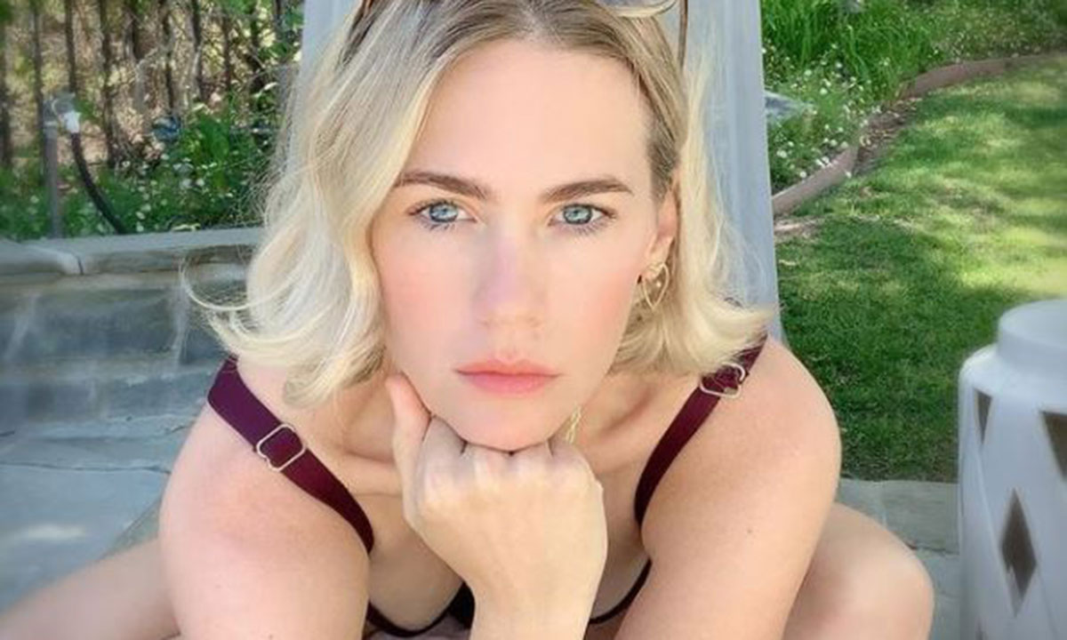 January Jones showcases incredible figure in plunging swimsuit - and fans are lost for words!