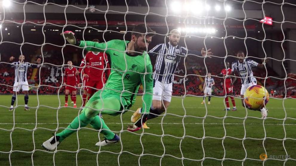 Football: Liverpool miss chance to stretch lead, Tottenham held at Wolves