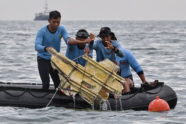 Indonesia plane crash: Jet may have 'ruptured' on impact as divers look for black boxes