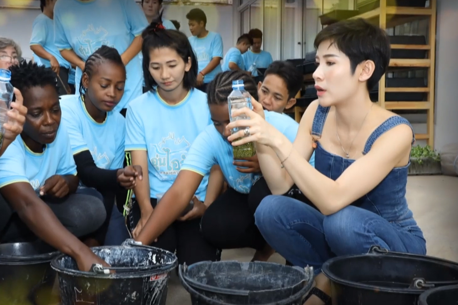 Palace photos show Thai king, royal consort visiting prisons, sweeping floors