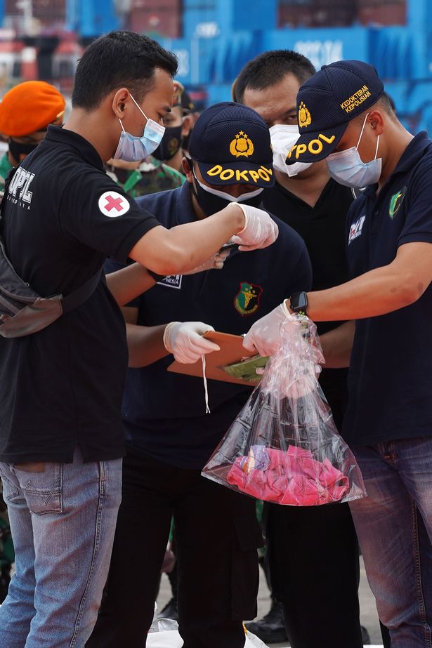Indonesia plane crash: Flight attendant identified as first victim by fingerprints