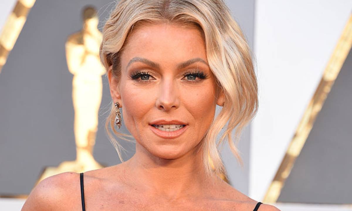 Kelly Ripa puts on a flirty display in frilly dress - and you should see her hair!