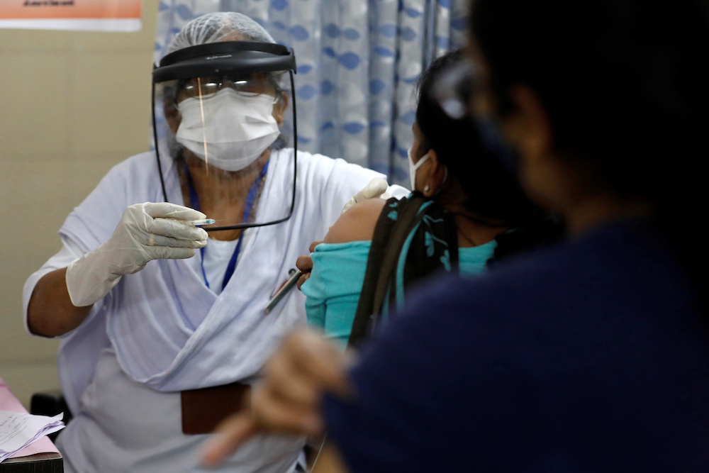 India coronavirus cases surge to four-month high, some lockdowns return