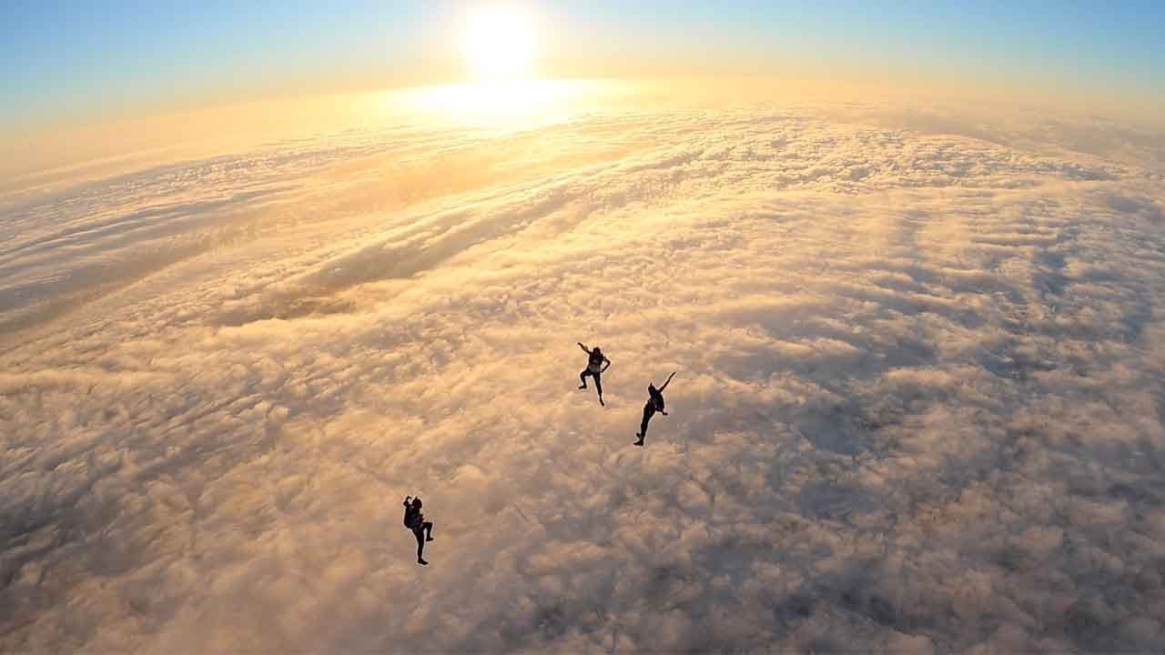 Standing Skydive Near Wall Of Clouds