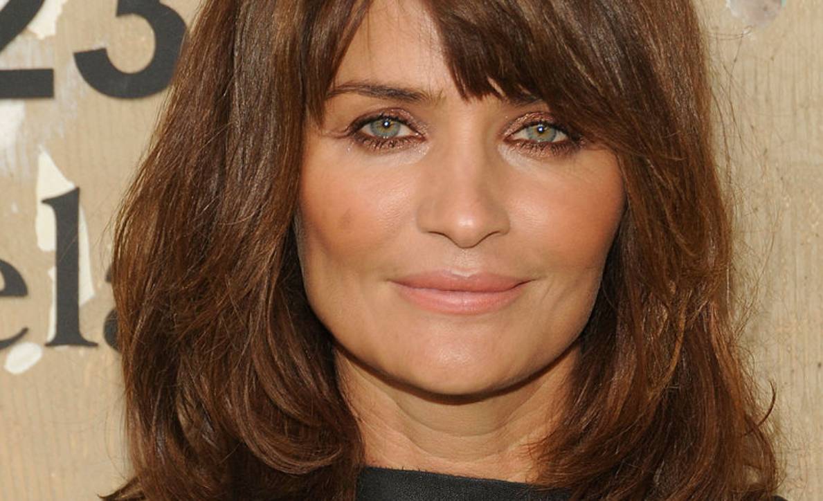 Helena Christensen's physique is unbelievable in multi-coloured swimsuit during tropical vacation