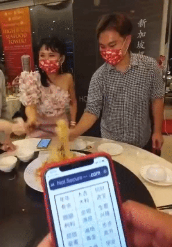 Family uses CNY app to lohei & shows US how surreal not shouting while tossing is