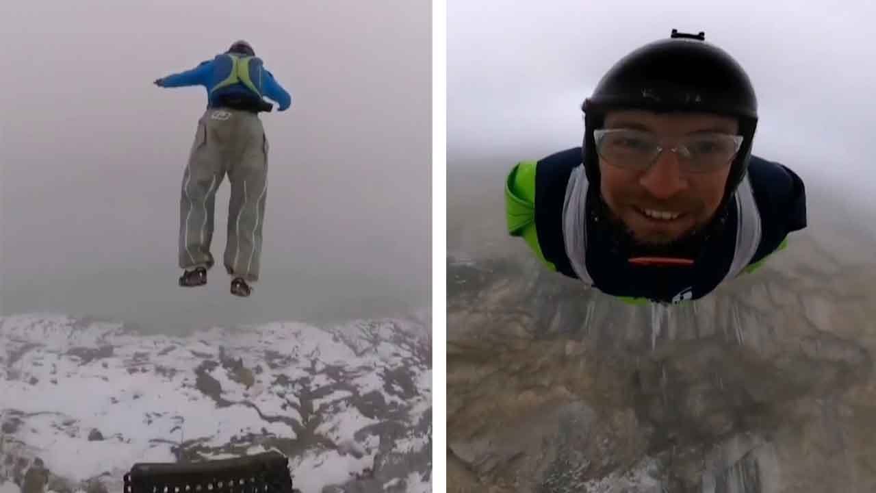 Thrill-Seekers Jump From Mountain Down Through Clouds