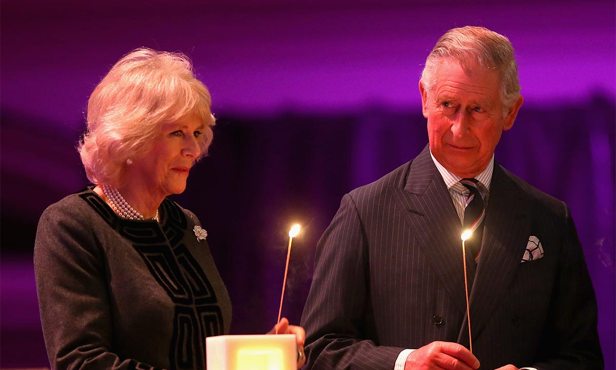 Prince Charles and Camilla light candles during moving Holocaust Memorial Day ceremony