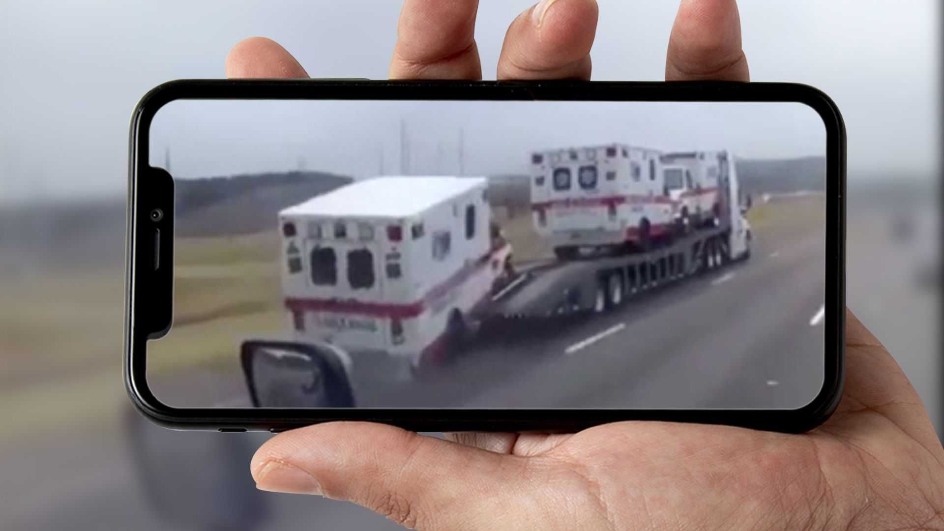 Watch ambulance fall off trailer, roll down motorway without a driver