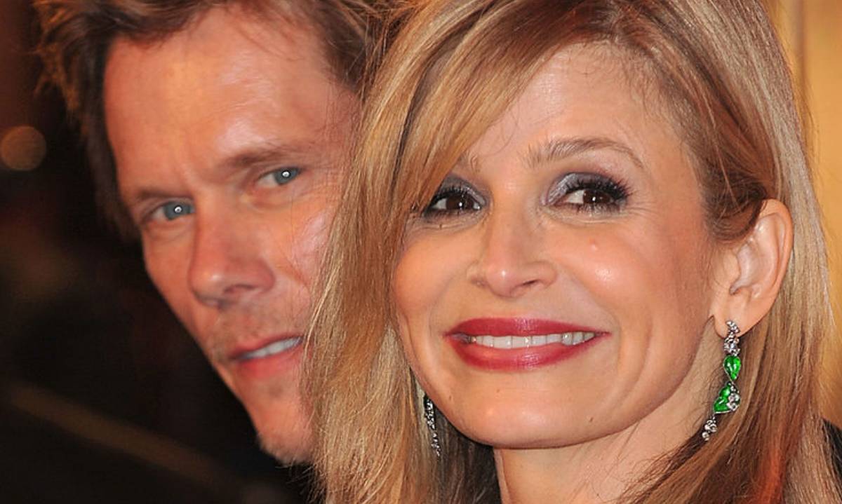 Kyra Sedgwick looks breathtaking in figure-skimming white silk gown - and husband Kevin Bacon agrees