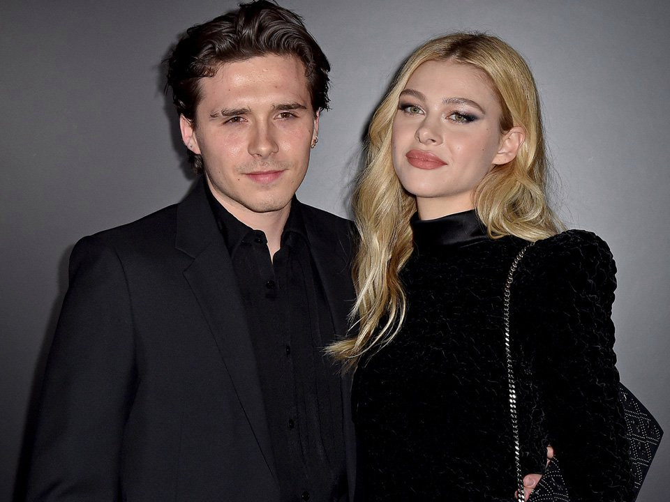 Brooklyn Beckham cosies up to fiancée Nicola Peltz for topless bedroom photo: ‘My other half’