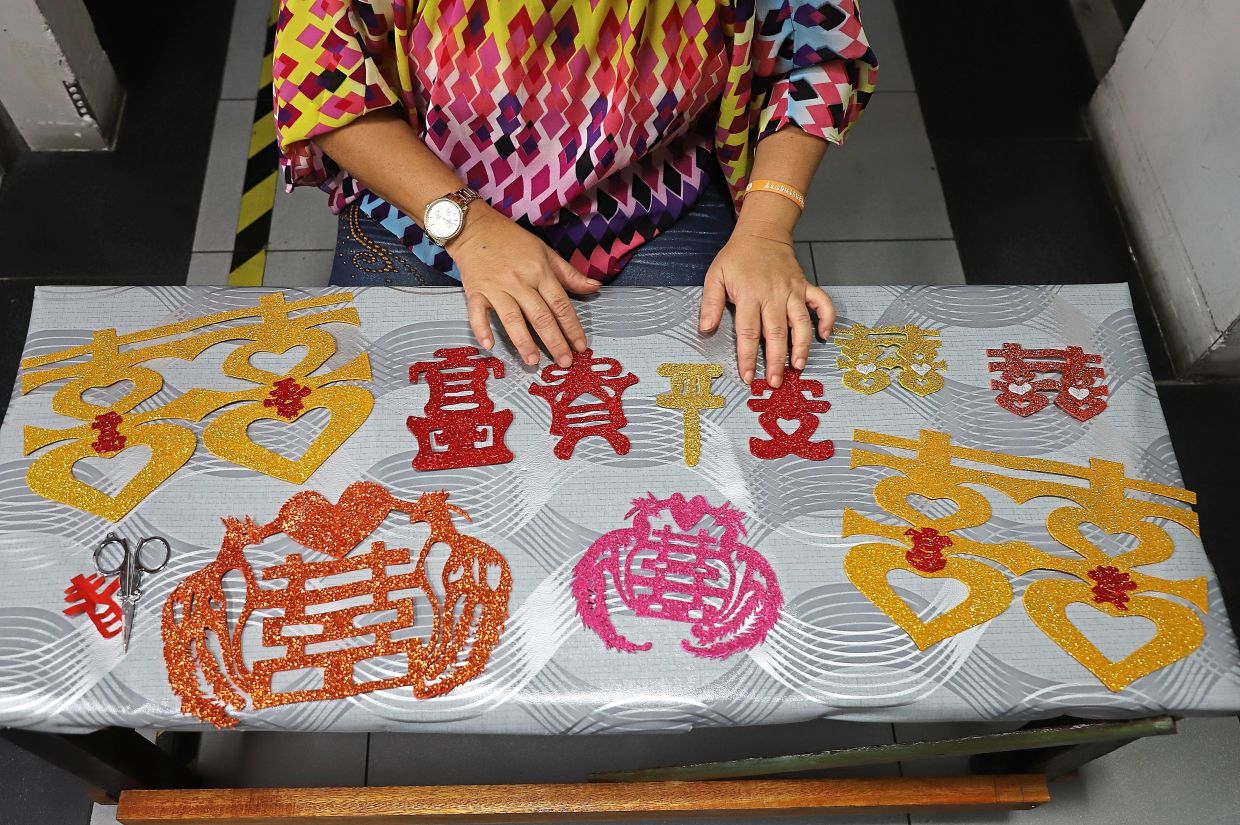 Chinese paper cutting art in demand for CNY