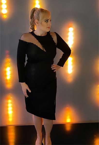 Rebel Wilson looks sensational in plunging black dress following split