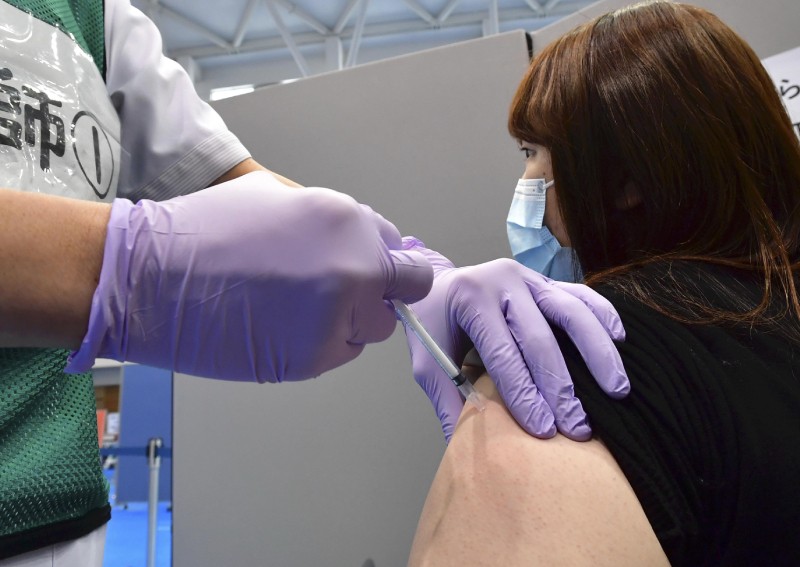 Japan to compile weekly reports on vaccine side effects
