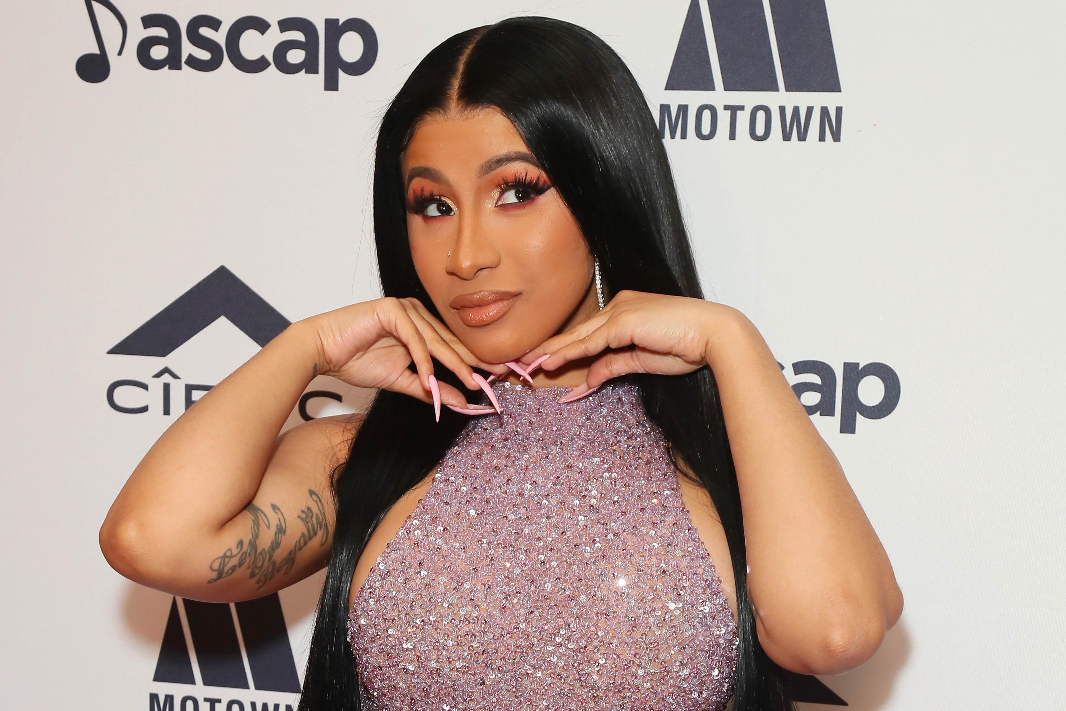 Cardi B shows off bright pink short hair after celebrating success of new single Up