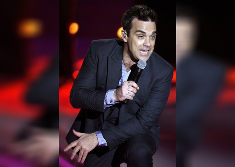 Robbie Williams accuses Noel and Liam Gallagher of driving him out of the UK with abusive jibes