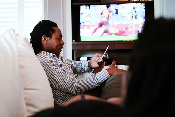 Etiquette expert shares tips as study shows 9 in 10 use phone while watching TV