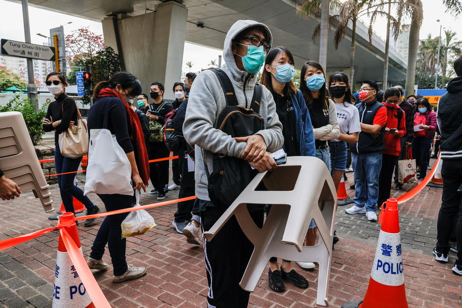 Hong Kong activists chant protest slogans as crowds gather for subversion hearing