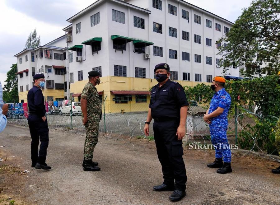 EMCO in Ipoh flat: Cops locate 22 foreign workers, one still missing