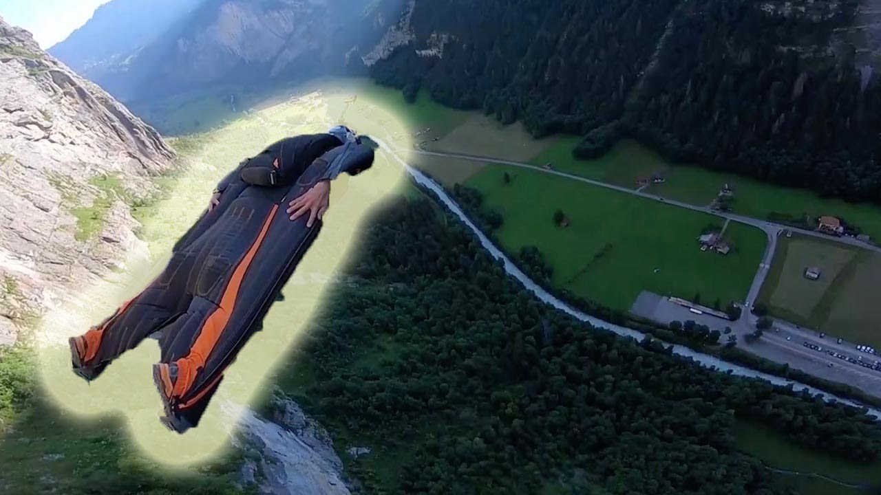 Wingsuit Coach's POV Glide Through Swiss Mountains