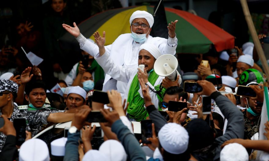 Indonesian cleric accused of incitement, breaking Covid-19 rules over celebrated homecoming