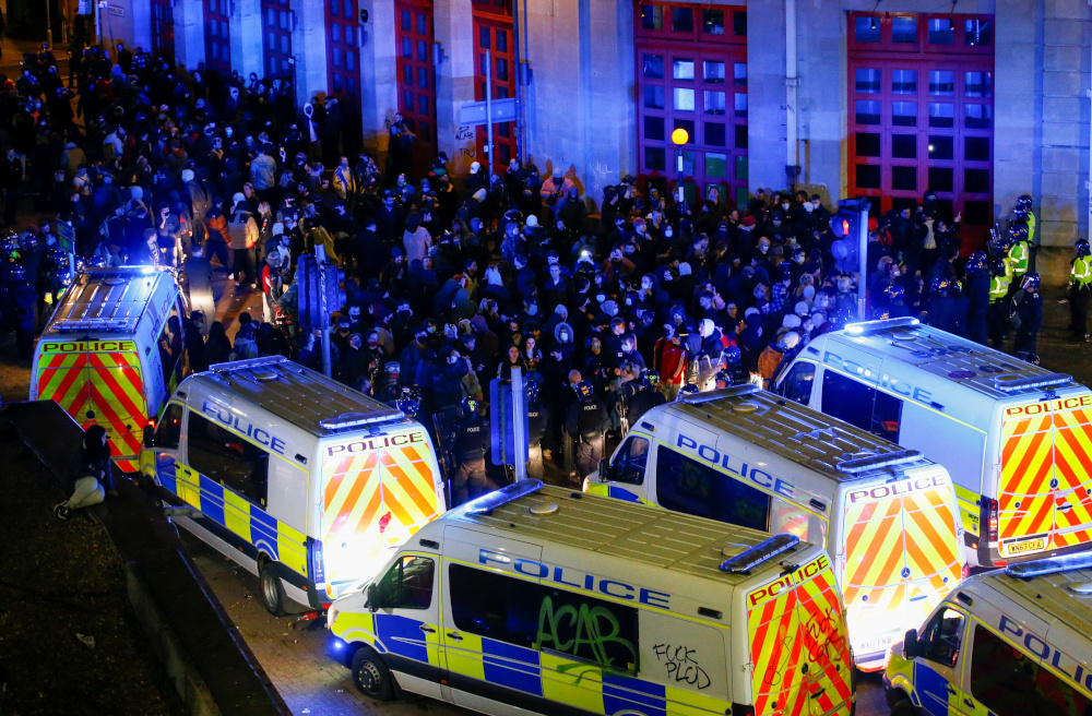 Protesters against policing bill clash with officers in Bristol, England