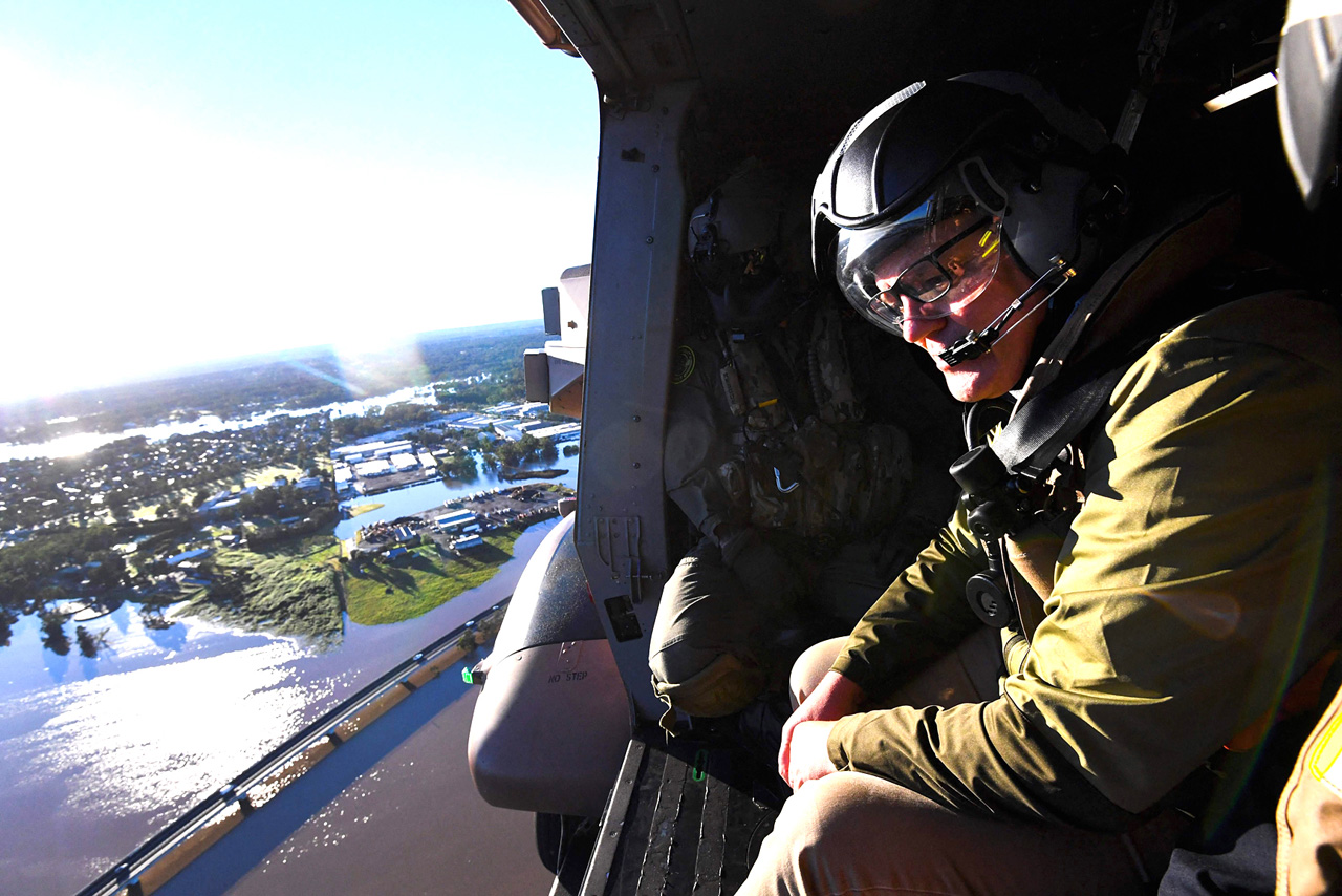 Rescuers rush aid to flood-hit Australians