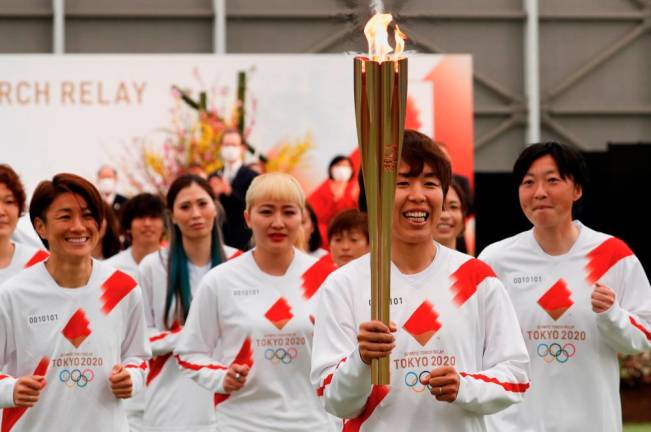 Tokyo Olympics torch relay starts in Fukushima’s shadow