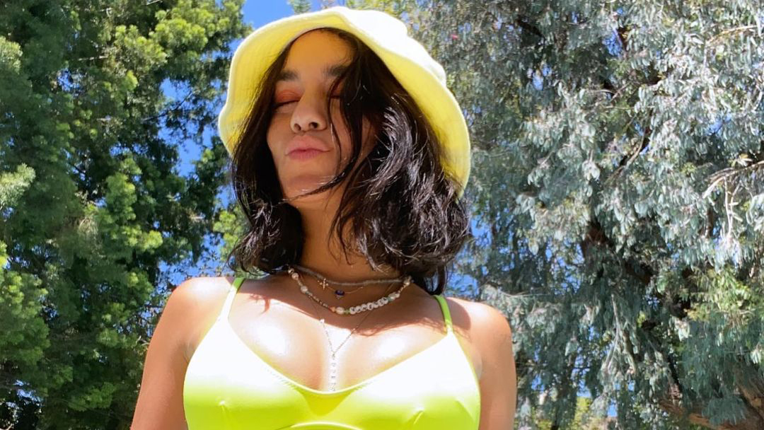 Vanessa Hudgens Matched a Neon Bikini to Her Bucket Hat