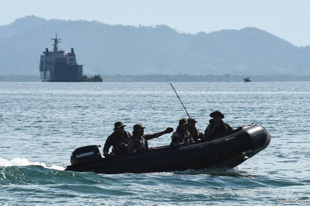 Philippine foreign minister issues expletive-laced tweet over China sea dispute