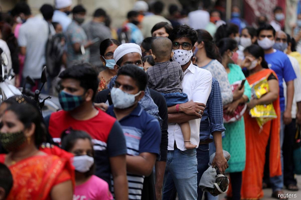 India's coronavirus cases hit record as Mumbai prepares for new lockdown