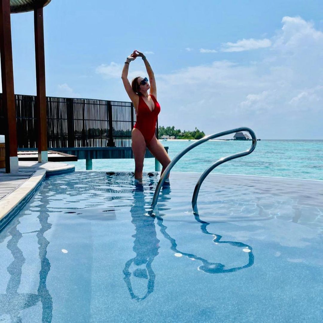 Lindsay Lohan Shows Off Her Curves in a Plunging Red Swimsuit in the Maldives