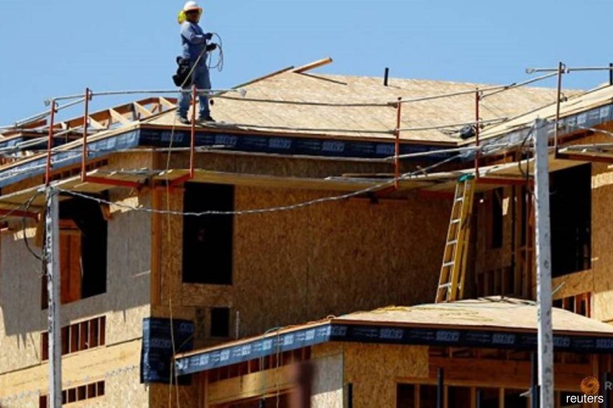 US housing starts near 15-year high; consumer sentiment rises moderately