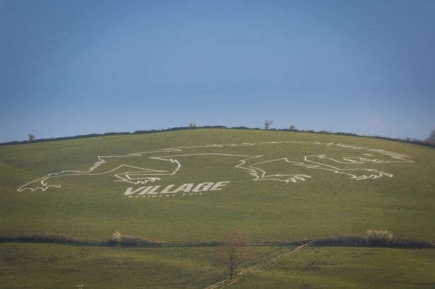 Giant ancient werewolf chalked onto hillside to mark release of Resident Evil Village