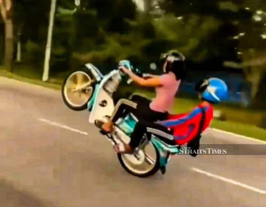Woman and teen nabbed after caughtoncamera wheelie act goes viral