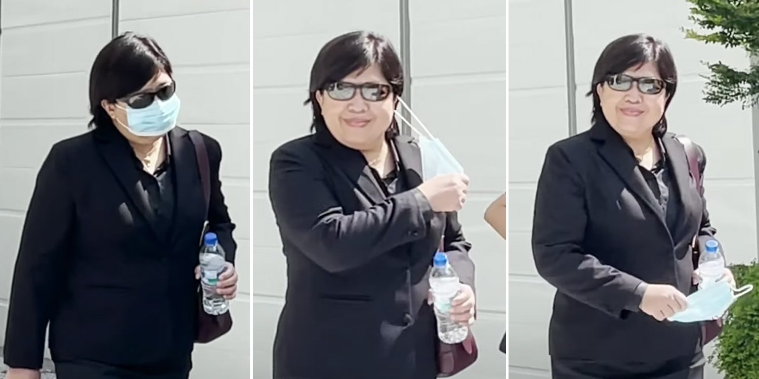 ‘Badge’ woman suddenly takes off mask when leaving court, stops & smiles at camera