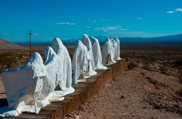 Google Earth user spots 'line of creepy men wearing white cloaks' in abandoned town