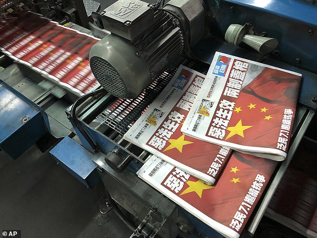 Hong Kong police raid pro-democracy Apple Daily newspaper and arrest five senior staff including its chief editor – as its billionaire owner Jimmy Lai faces years in jail on collusion charges