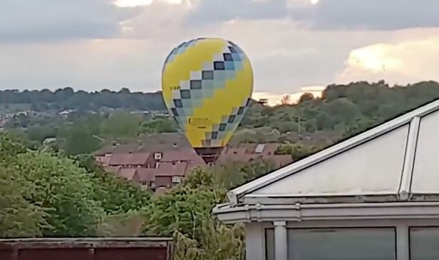 Incredible moment hot air balloon accidentally lands in a housing estate