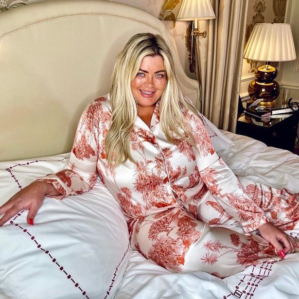 Gemma Collins goes make-up free as she lounges on a bed in silky pyjamas