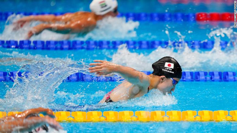 Japanese swimmer hopes gold medal rush can help heal divided nation