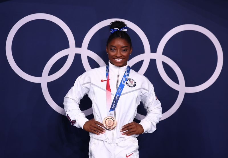 Gymnastics- Biles fights off fears and "twisties" to claim "sweeter bronze than Rio"